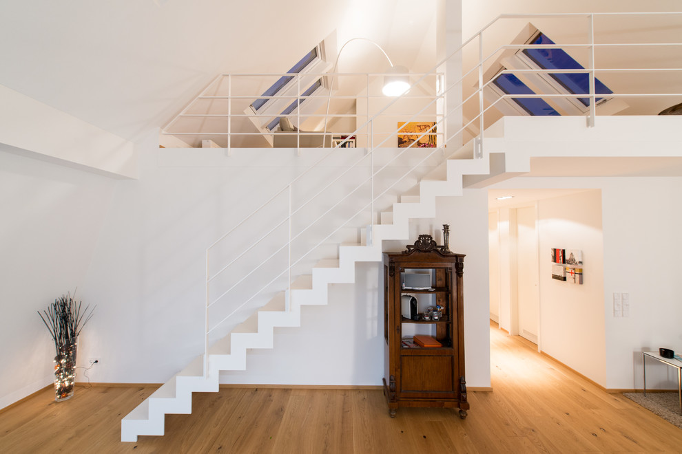 Small contemporary straight staircase in Munich.