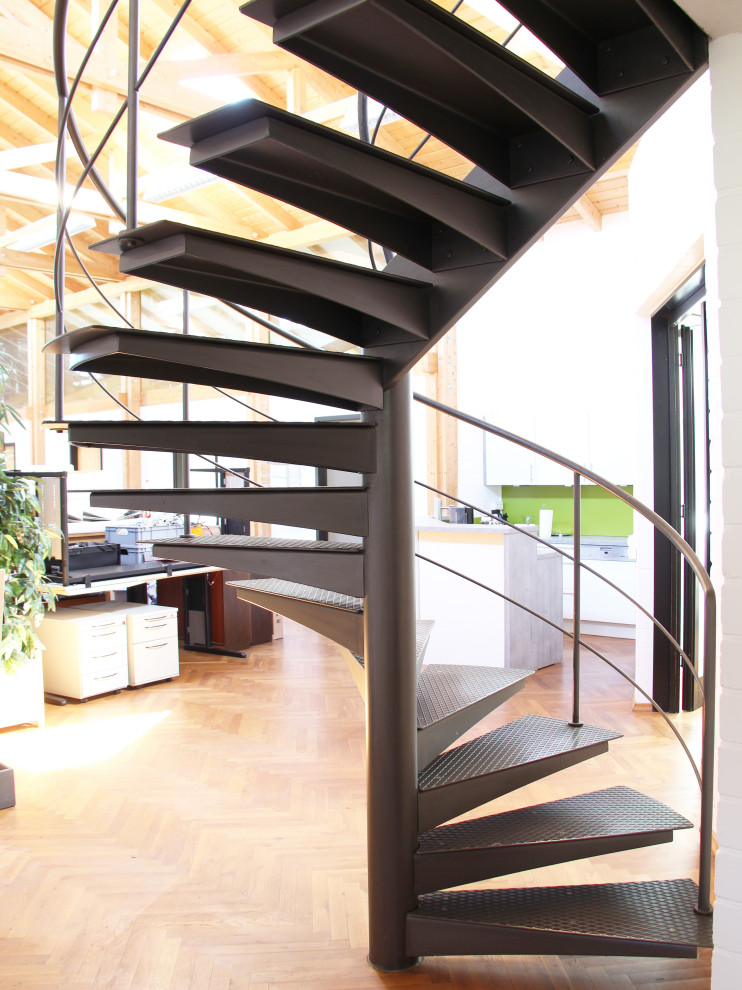 Medium sized industrial metal spiral metal railing staircase in Dusseldorf.