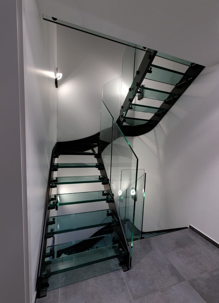 Medium sized contemporary glass curved staircase in Other.