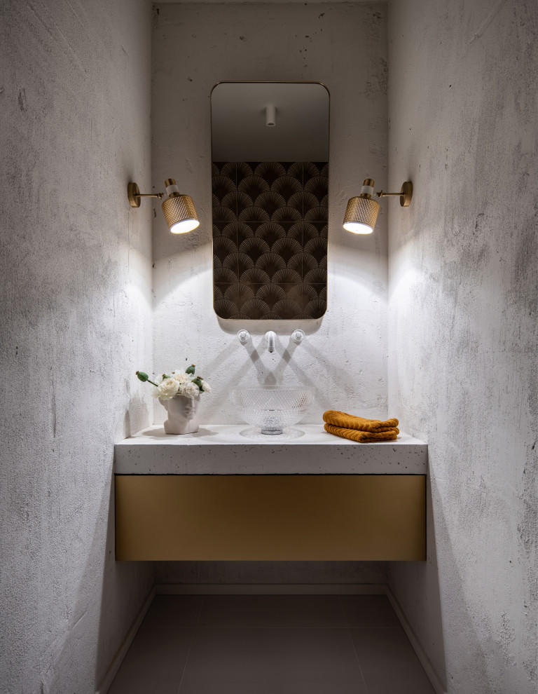 Ispirazione per un piccolo bagno di servizio design con ante lisce, pareti grigie, lavabo a bacinella, pavimento grigio e top bianco