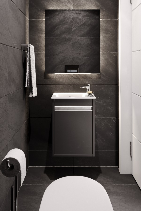Стильный дизайн: туалет среднего размера в современном стиле с плоскими фасадами, черными фасадами, инсталляцией, черной плиткой, керамогранитной плиткой, черными стенами, полом из керамической плитки, подвесной раковиной, стеклянной столешницей и черным полом - последний тренд