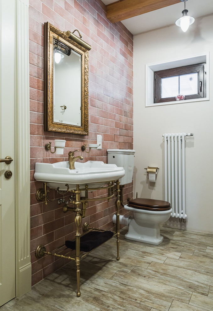 Inspiration for a mid-sized timeless porcelain tile and brown tile porcelain tile, beige floor and exposed beam powder room remodel in Moscow with a one-piece toilet, multicolored walls, a console sink, quartzite countertops, white countertops and a freestanding vanity
