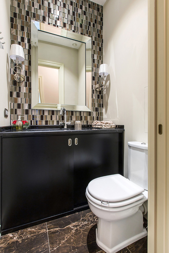 Design ideas for a classic cloakroom in Moscow with flat-panel cabinets, black cabinets, a two-piece toilet, brown tiles, white walls, a submerged sink, marble worktops and brown floors.