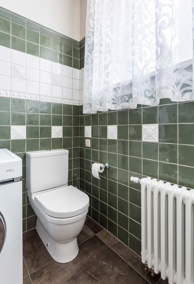 Medium sized traditional cloakroom in Moscow with green tiles, porcelain tiles, white walls, porcelain flooring, brown floors and a two-piece toilet.