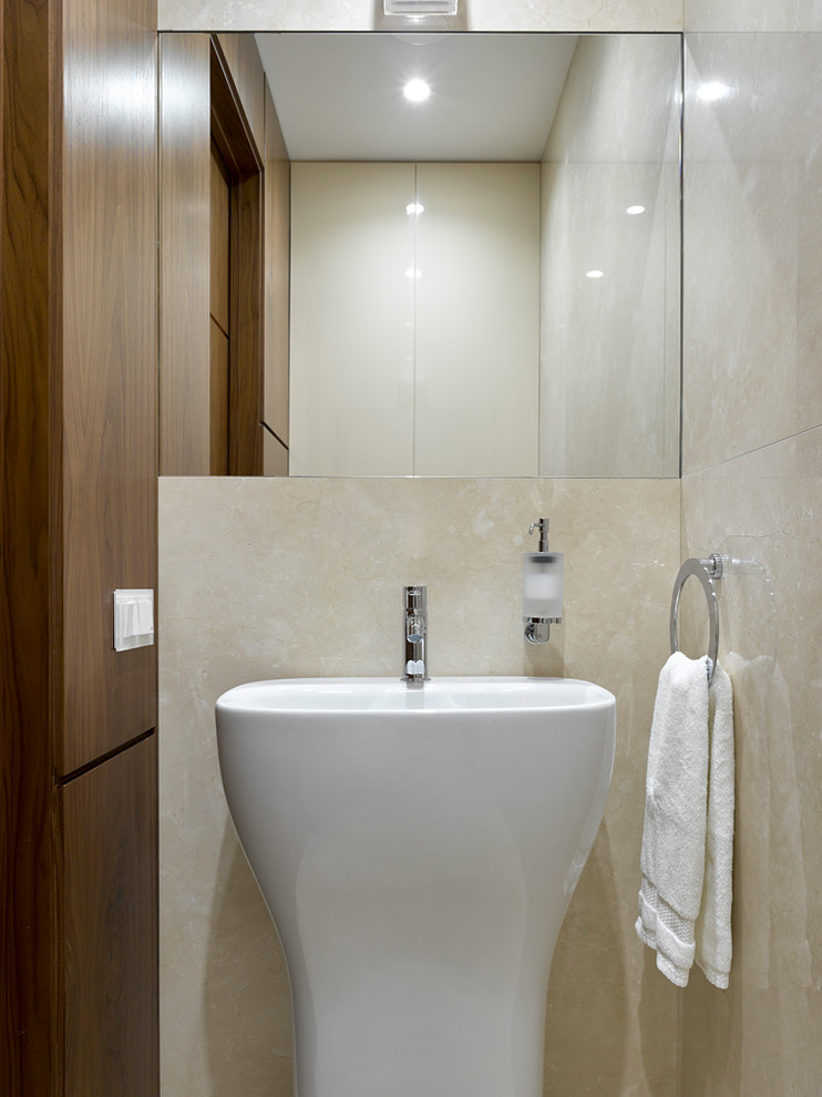 Photo of a contemporary cloakroom in Moscow with a pedestal sink.