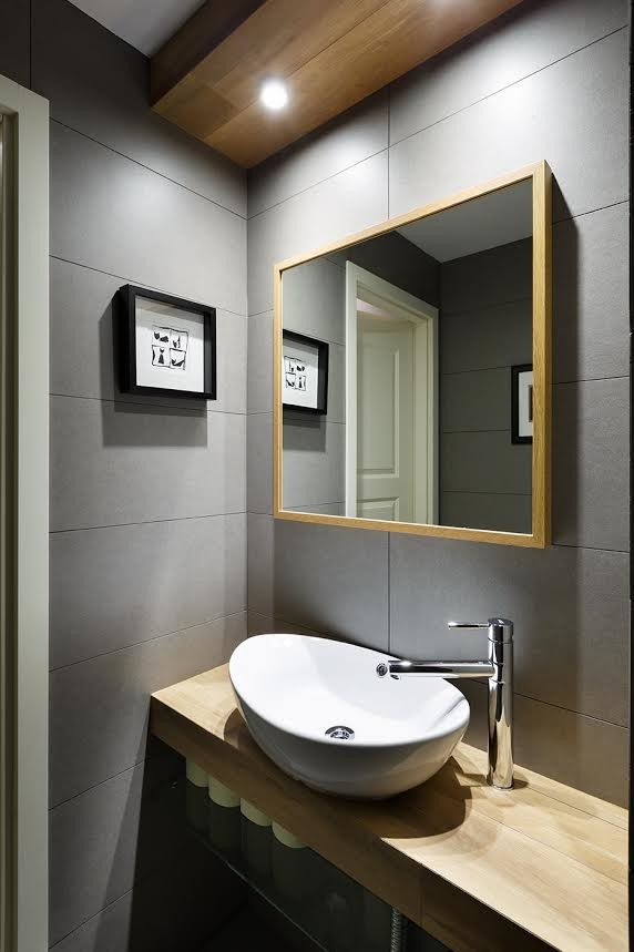 Design ideas for a contemporary cloakroom in Other with open cabinets, grey tiles, a vessel sink and wooden worktops.