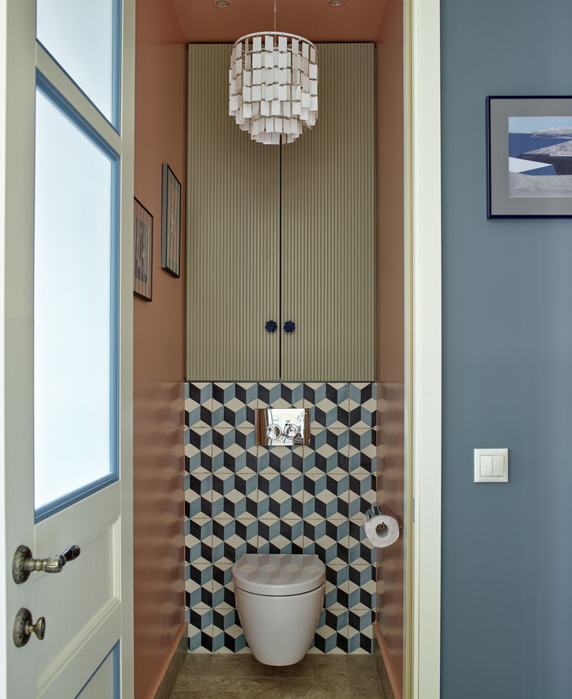 На фото: туалет в стиле неоклассика (современная классика) с инсталляцией, плоскими фасадами и синей плиткой