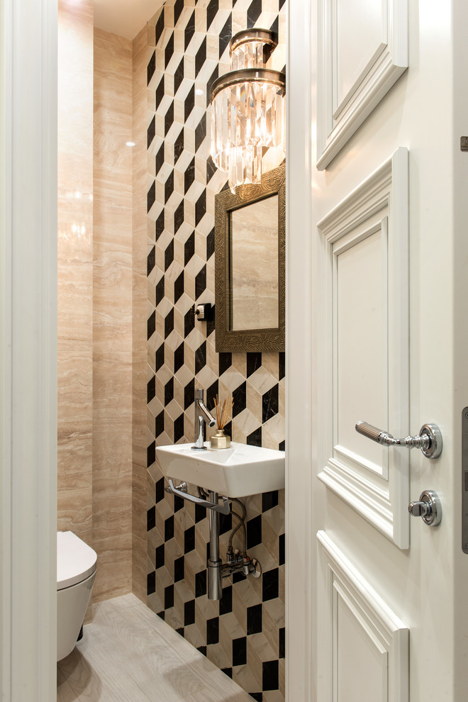 Foto de aseo clásico renovado con sanitario de pared, baldosas y/o azulejos beige y lavabo suspendido