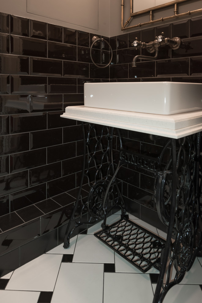 Design ideas for a classic cloakroom in Other with black and white tiles, black tiles, metro tiles, grey walls and a vessel sink.