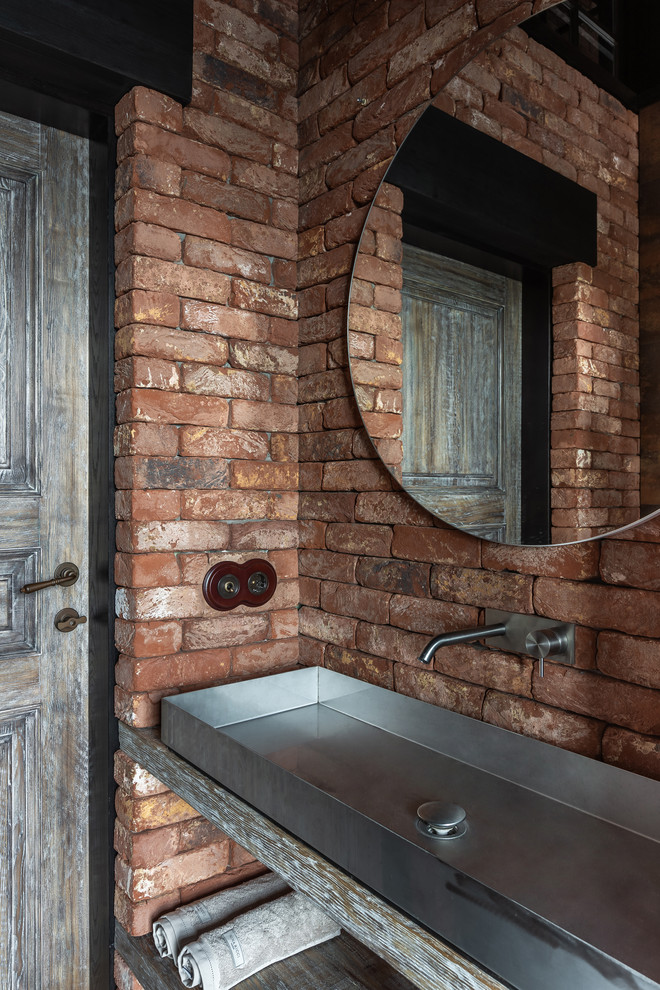 Inspiration for an industrial powder room remodel in Other