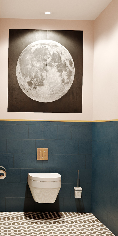 Inspiration för små moderna svart toaletter, med släta luckor, en vägghängd toalettstol, blå kakel, keramikplattor, rosa väggar, klinkergolv i keramik, flerfärgat golv, svarta skåp, ett nedsänkt handfat och bänkskiva i akrylsten
