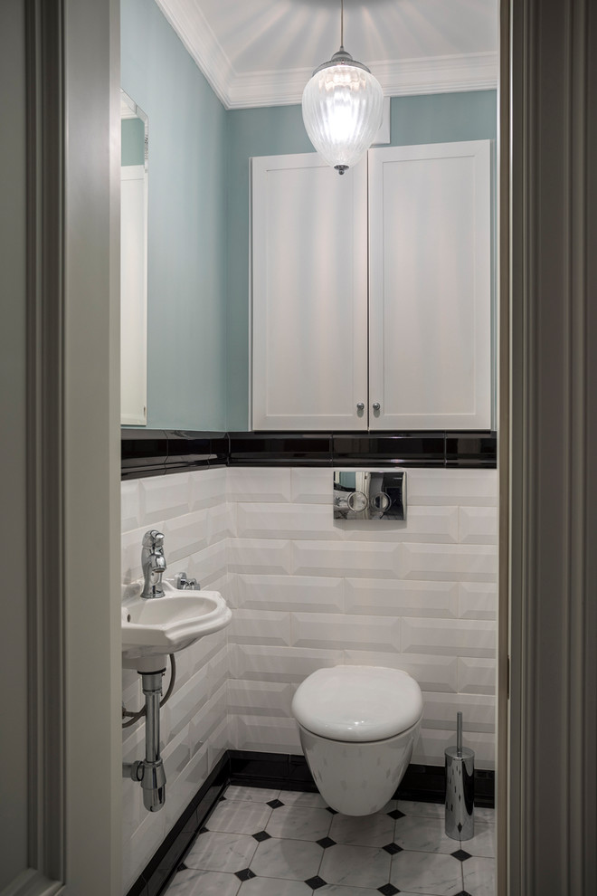 Источник вдохновения для домашнего уюта: туалет в классическом стиле с инсталляцией, синими стенами, подвесной раковиной и белым полом