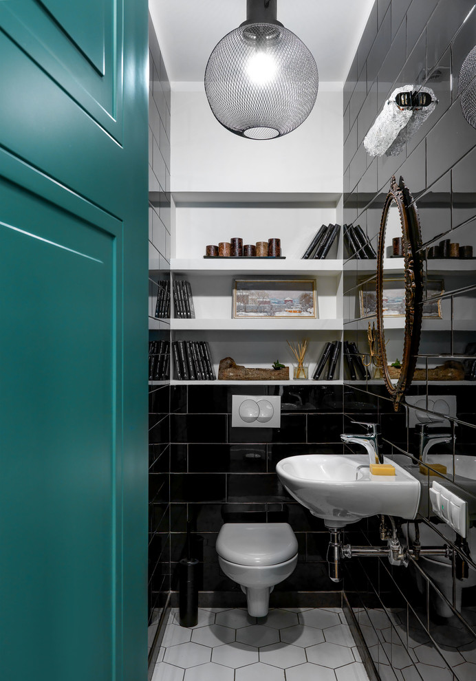 Contemporary cloakroom in Moscow with a wall mounted toilet, black tiles, white walls, a wall-mounted sink and white floors.