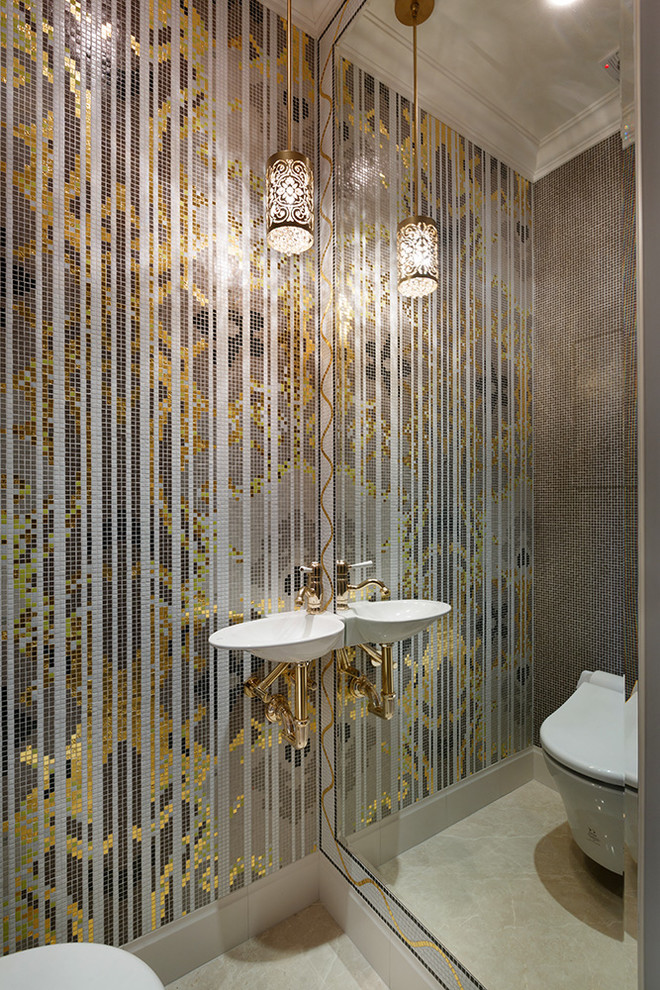 На фото: туалет в классическом стиле с инсталляцией, разноцветной плиткой, плиткой мозаикой, подвесной раковиной и бежевым полом