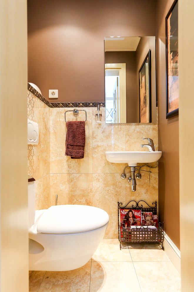 Example of a trendy beige tile powder room design in Moscow with a wall-mount toilet, brown walls and a wall-mount sink