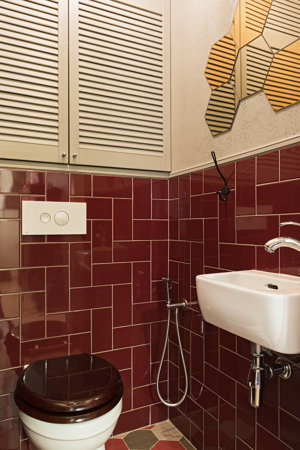 Inspiration for a small classic cloakroom in Other with a wall mounted toilet, red tiles, ceramic tiles, grey walls, porcelain flooring and multi-coloured floors.