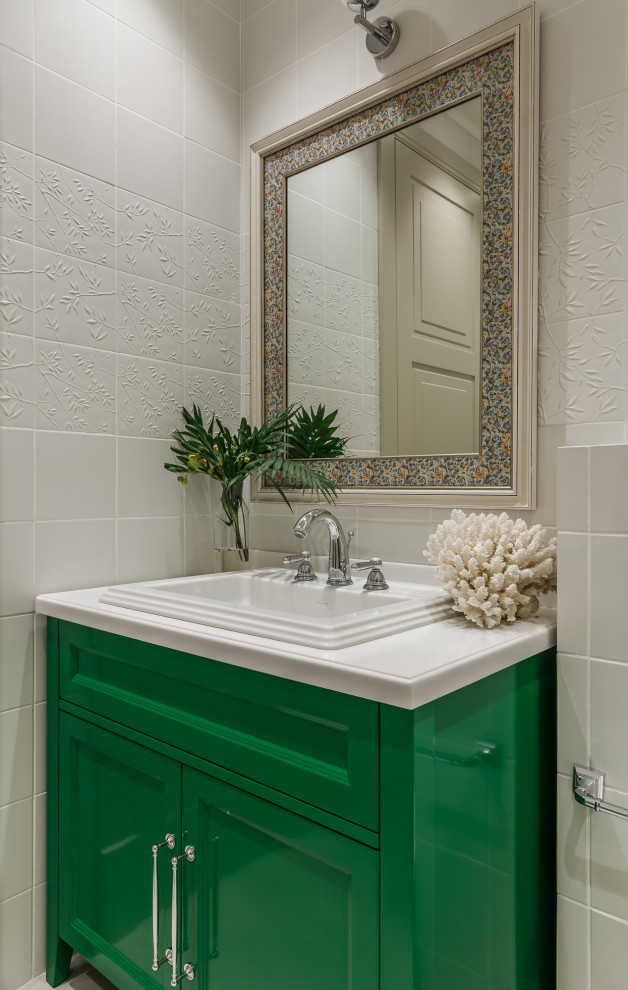 Mid-sized transitional gray tile powder room photo in Moscow with recessed-panel cabinets, green cabinets, a drop-in sink, white countertops and a built-in vanity