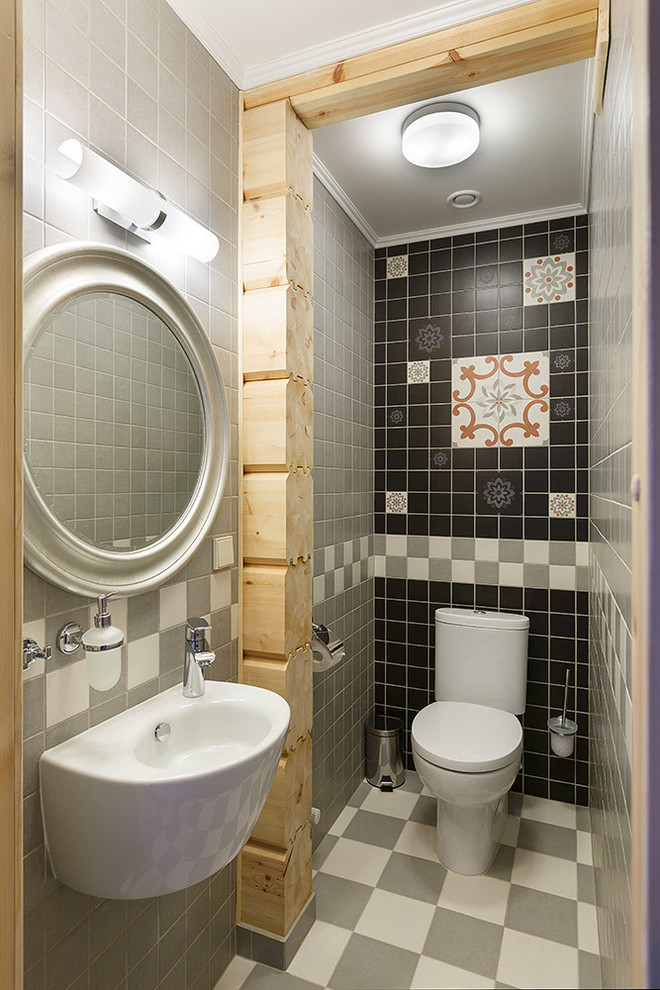 Inspiration for a small bohemian cloakroom in Saint Petersburg with a two-piece toilet, multi-coloured tiles, a wall-mounted sink and multi-coloured floors.