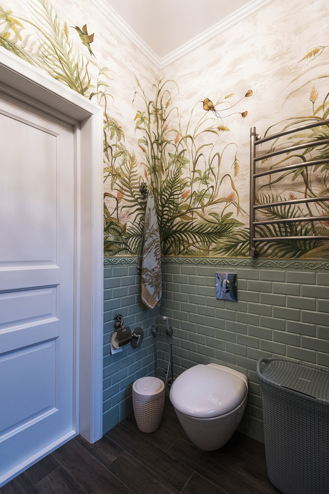 Photo of a medium sized cloakroom in Other with a wall mounted toilet and green walls.