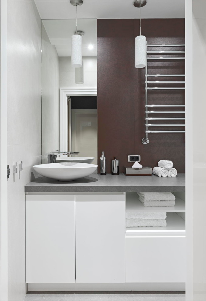 Inspiration for a contemporary cloakroom in Moscow with flat-panel cabinets, white cabinets, a vessel sink, grey floors and grey worktops.