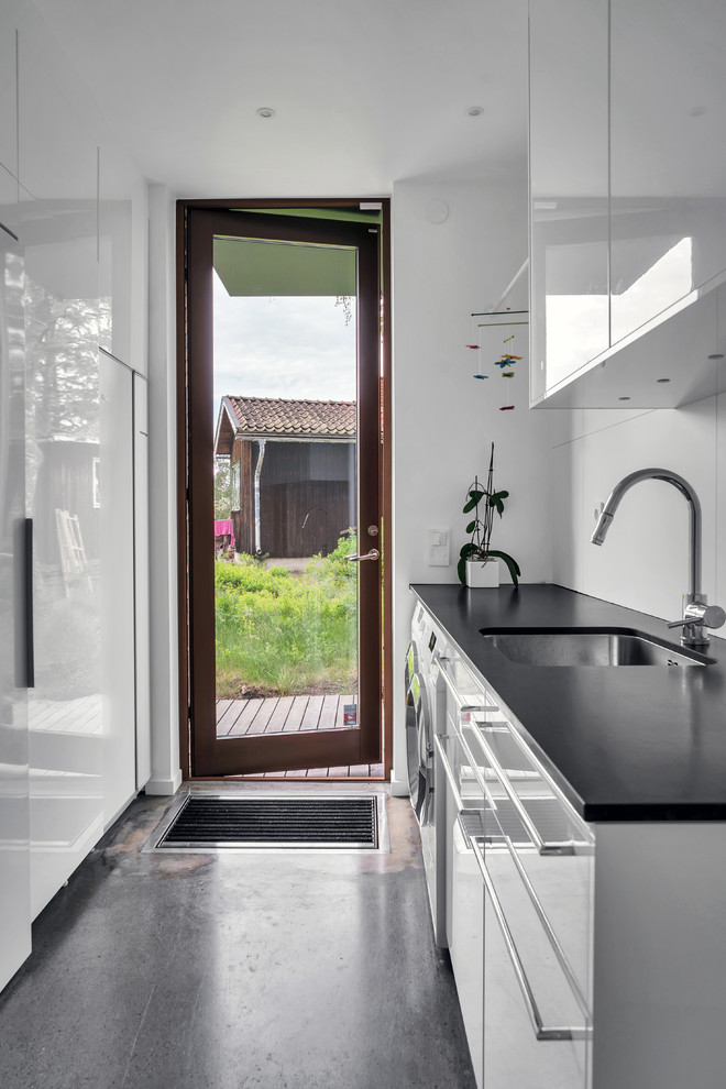 Inspiration for a scandinavian laundry room remodel in Stockholm