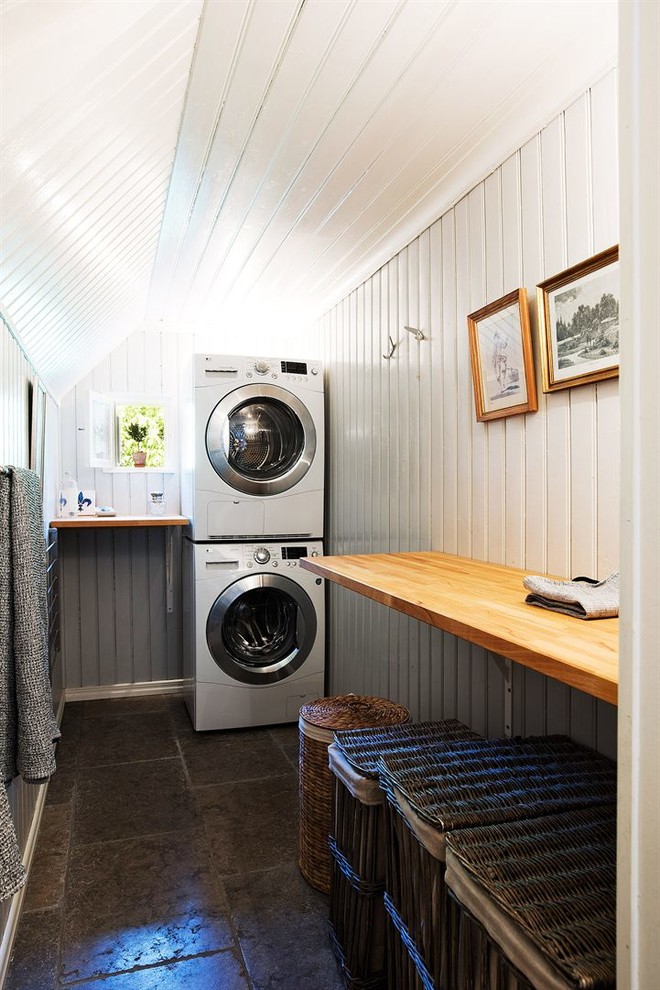 Laundry room - cottage laundry room idea in Stockholm