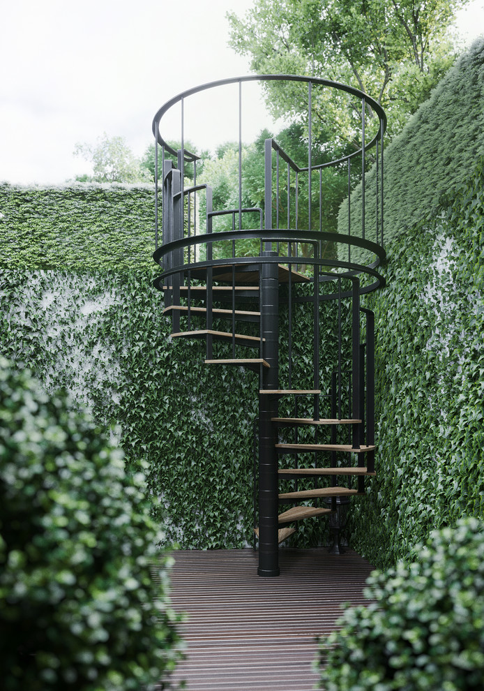 Immagine di un giardino minimal esposto in pieno sole con scale