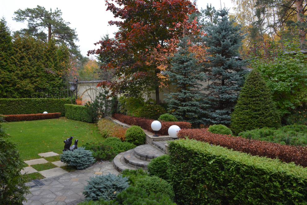 Traditional formal fully shaded garden for autumn in Moscow.