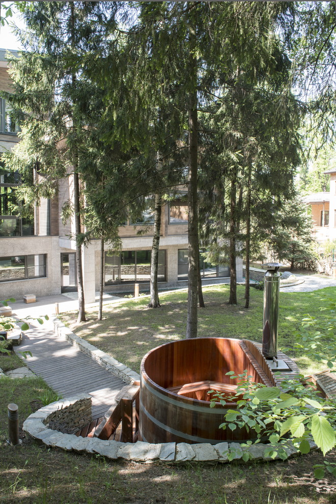 Photo of a medium sized farmhouse garden in Moscow with decking.
