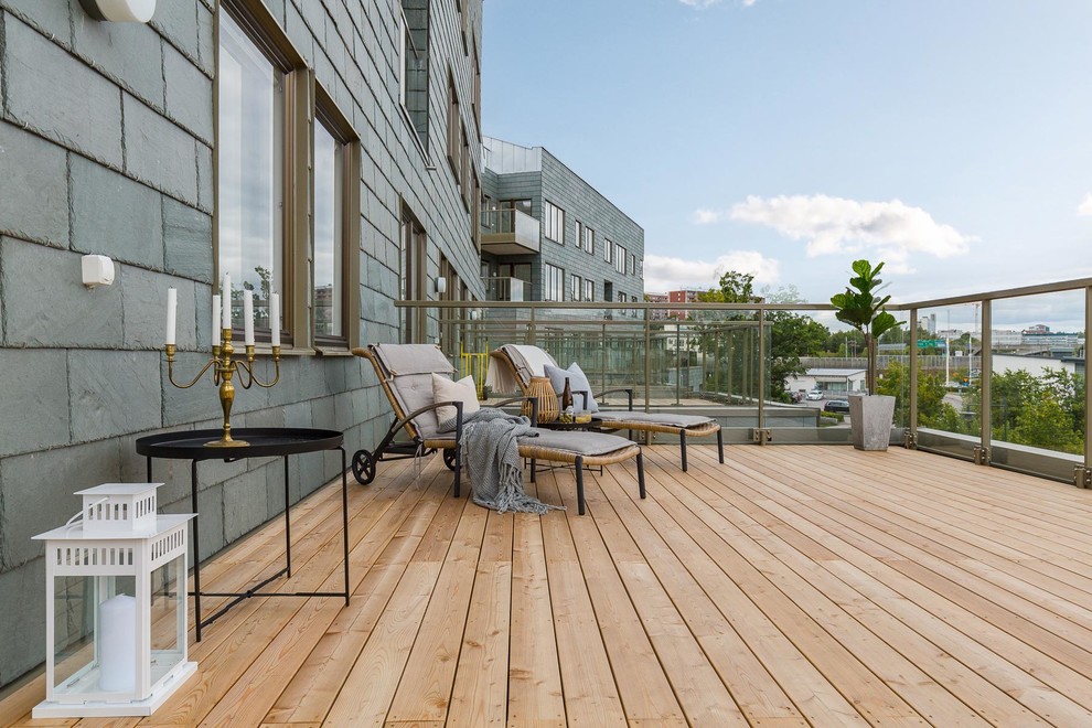 Inspiration for a classic patio in Stockholm with decking and no cover.