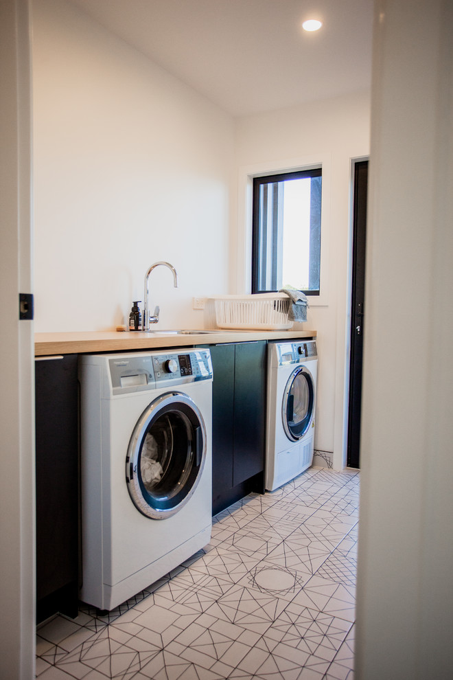 Inspiration for a contemporary laundry room remodel in Hamilton