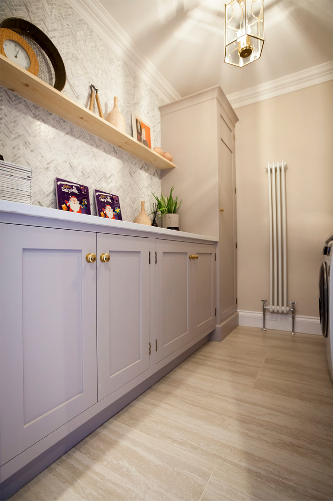 Example of a small trendy galley laundry room design in Other with shaker cabinets, gray cabinets, solid surface countertops, a side-by-side washer/dryer and white countertops