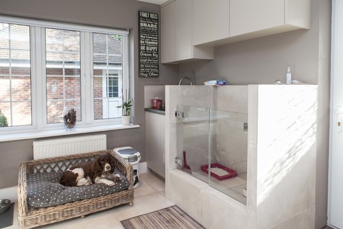 Mudroom with Raised dog bed and a large dog shower, plus a place to store dog food.   