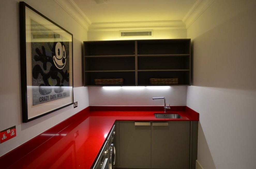Example of a mid-sized minimalist utility room design in London