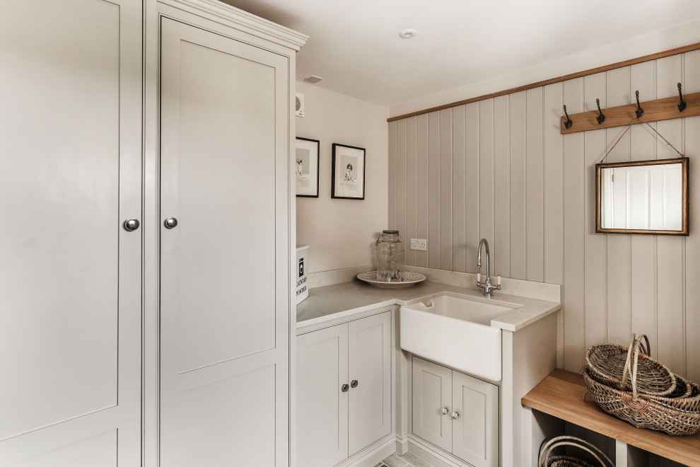 Laundry room - cottage laundry room idea in Surrey