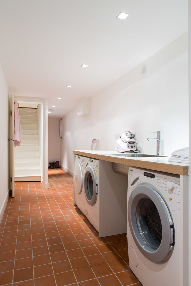 This is an example of a contemporary utility room in London.