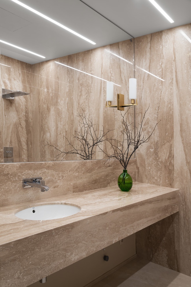 This is an example of a small contemporary bathroom in Moscow with beige tiles, marble tiles, marble flooring, a submerged sink, marble worktops, beige floors and beige worktops.