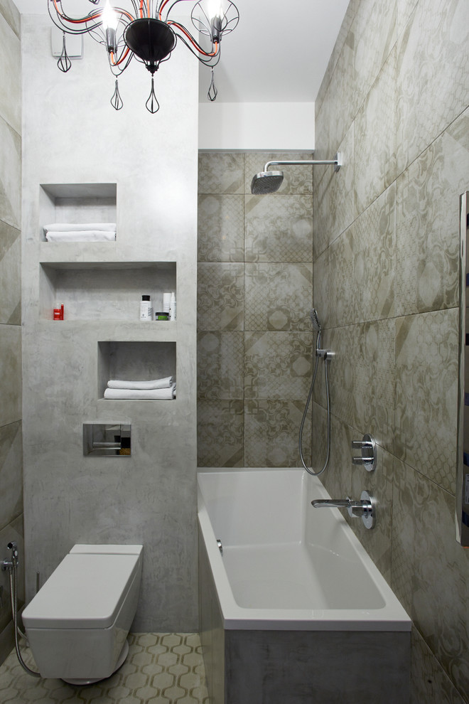 Industrial ensuite bathroom in Moscow with a shower/bath combination, grey tiles, grey walls, a vessel sink and grey floors.