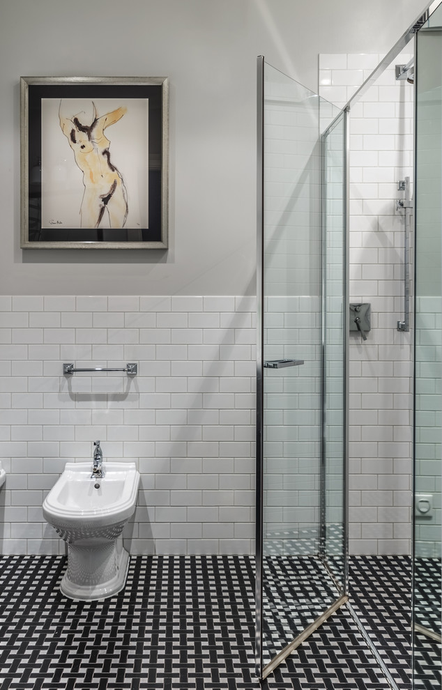Example of a mid-sized classic 3/4 white tile and ceramic tile porcelain tile and multicolored floor alcove shower design in Other with a bidet, gray walls and a hinged shower door