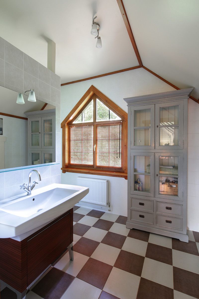 Large farmhouse bathroom in Moscow with multi-coloured floors, flat-panel cabinets, brown cabinets, an alcove bath, grey tiles, ceramic tiles, white walls, ceramic flooring and a built-in sink.