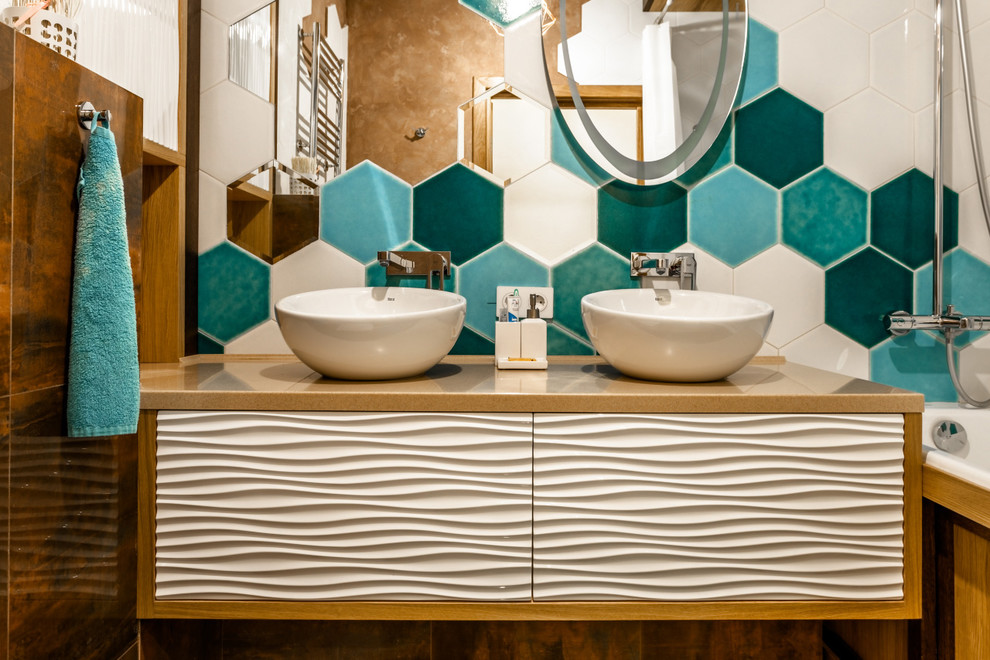 Inspiration for a small eclectic ensuite bathroom in Yekaterinburg with white cabinets, a wall mounted toilet, brown walls, porcelain flooring, brown floors, recessed-panel cabinets, an alcove bath, white tiles, porcelain tiles, a vessel sink, solid surface worktops and beige worktops.