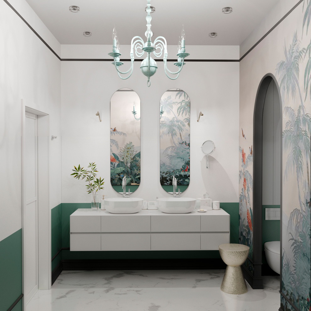 На фото: ванная комната в современном стиле с плоскими фасадами, белыми фасадами, отдельно стоящей ванной, душем в нише, инсталляцией, разноцветной плиткой, зелеными стенами, мраморным полом, настольной раковиной, белым полом, душем с распашными дверями, белой столешницей и акцентной стеной с