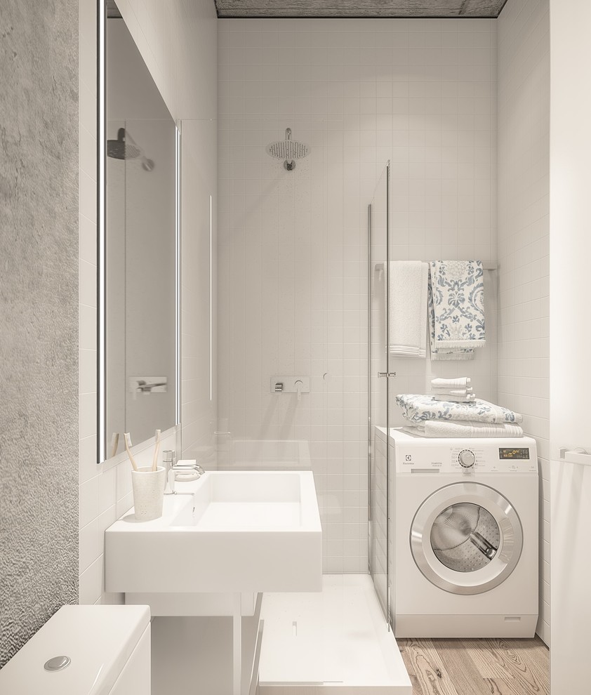 Inspiration för ett litet nordiskt badrum med dusch, med grå skåp, en dusch i en alkov, en toalettstol med hel cisternkåpa, vit kakel, grå väggar, mellanmörkt trägolv, ett piedestal handfat och bänkskiva i akrylsten