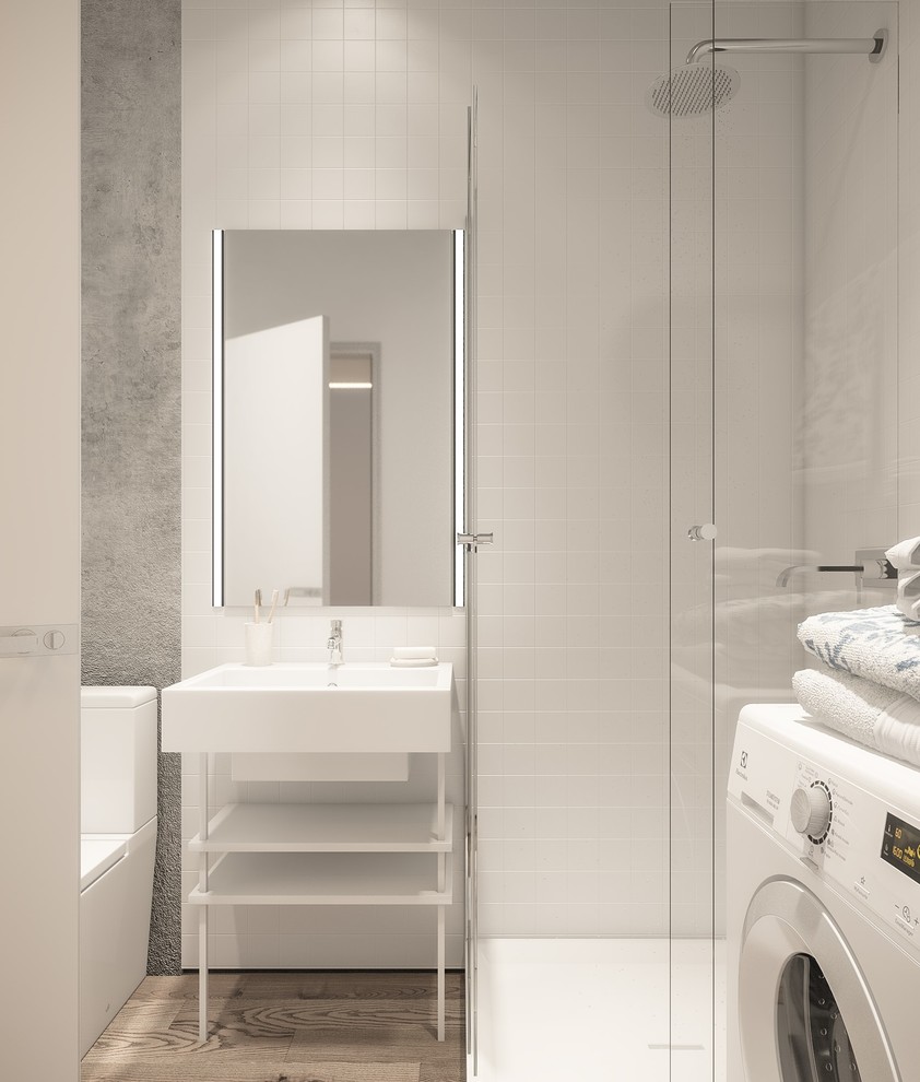 Idée de décoration pour une petite salle de bain nordique avec des portes de placard grises, WC à poser, un carrelage blanc, un mur gris, un sol en bois brun, un lavabo de ferme et un plan de toilette en surface solide.