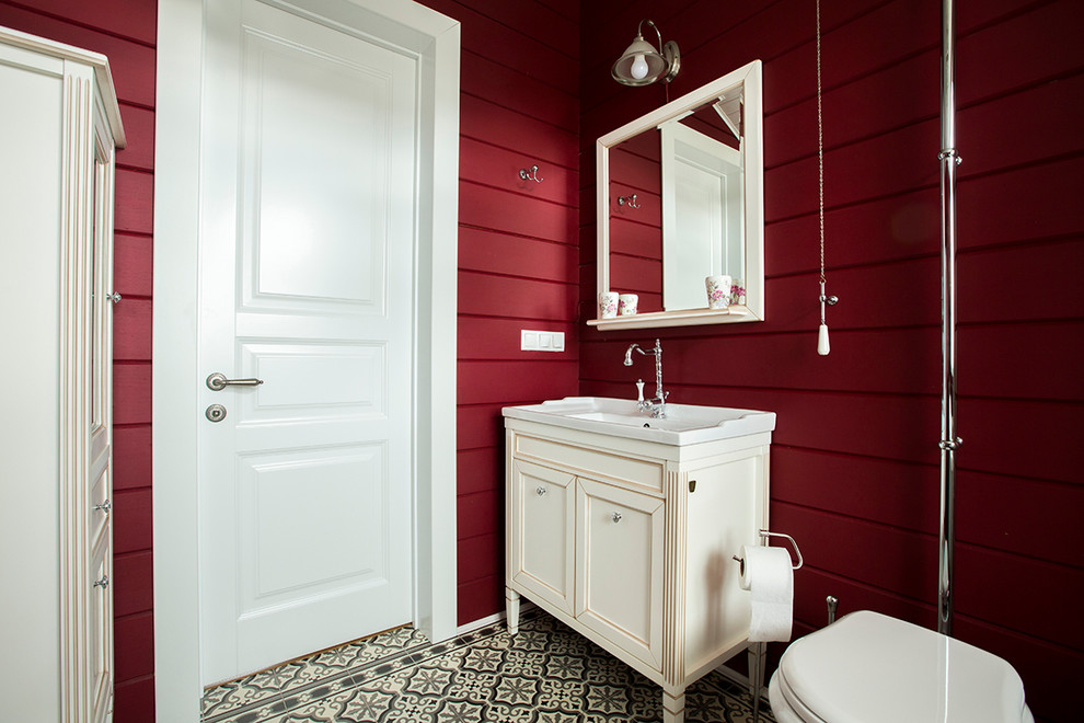 This is an example of a farmhouse bathroom in Moscow with an alcove shower, a two-piece toilet, white walls and a console sink.