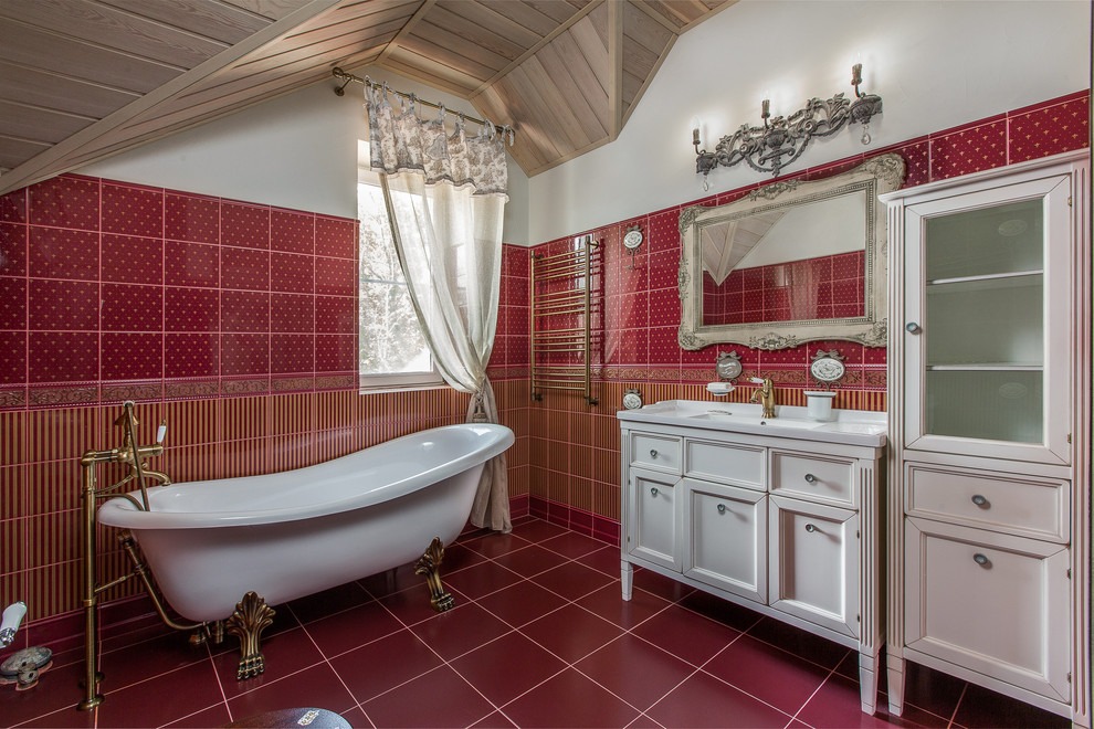 Traditional ensuite bathroom in Other with recessed-panel cabinets, white cabinets, a claw-foot bath, red tiles, red walls and red floors.