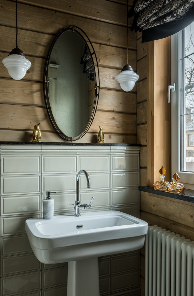 Rustic bathroom in Other with grey tiles, metro tiles, a pedestal sink, a single sink and wood walls.