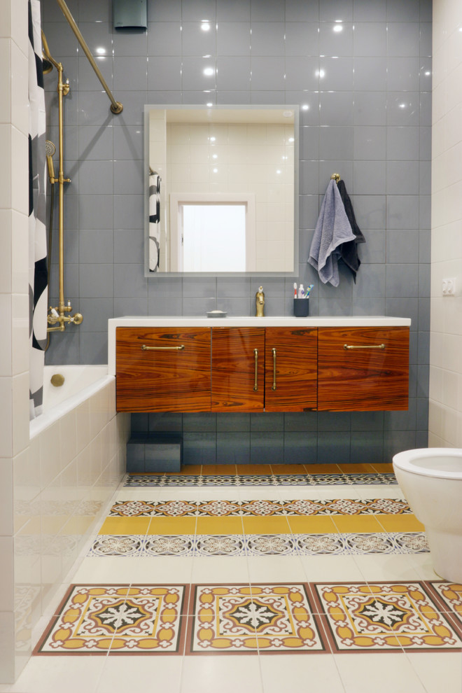 Large contemporary ensuite bathroom in Moscow with flat-panel cabinets, dark wood cabinets, an alcove bath, a two-piece toilet, multi-coloured tiles, ceramic tiles, multi-coloured walls, ceramic flooring, an integrated sink, engineered stone worktops, multi-coloured floors and white worktops.