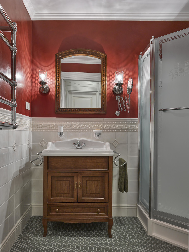 Cette photo montre une salle d'eau chic en bois brun avec un carrelage blanc, des carreaux de céramique, un mur rouge, un sol en carrelage de céramique, un placard avec porte à panneau encastré, une douche d'angle et un plan vasque.