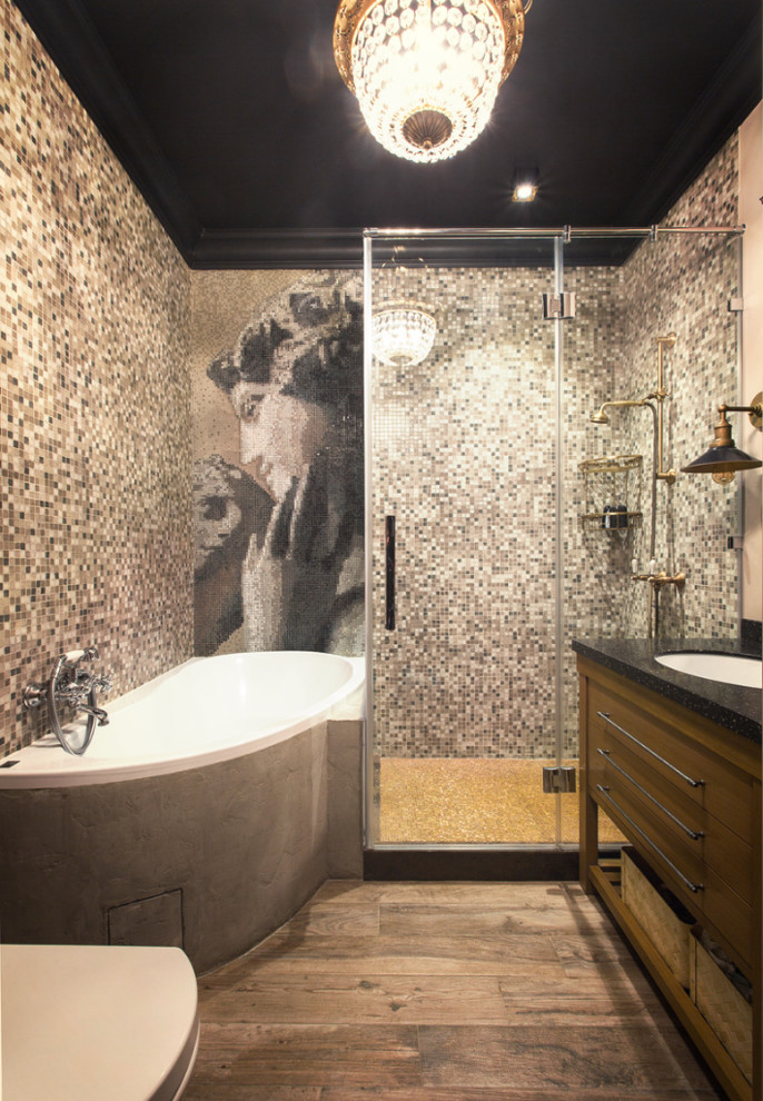 Идея дизайна: главная ванная комната среднего размера в стиле фьюжн с угловой ванной, серой плиткой, врезной раковиной, коричневым полом, душем с распашными дверями, фасадами цвета дерева среднего тона и угловым душем